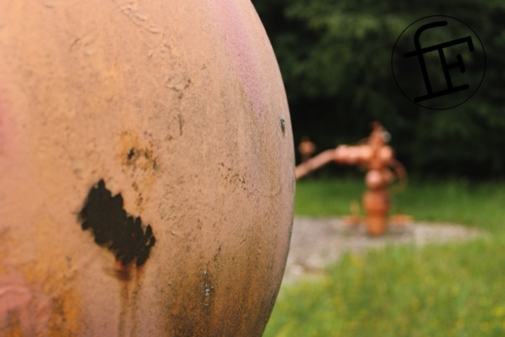 an orange gas tank taken in closeup.