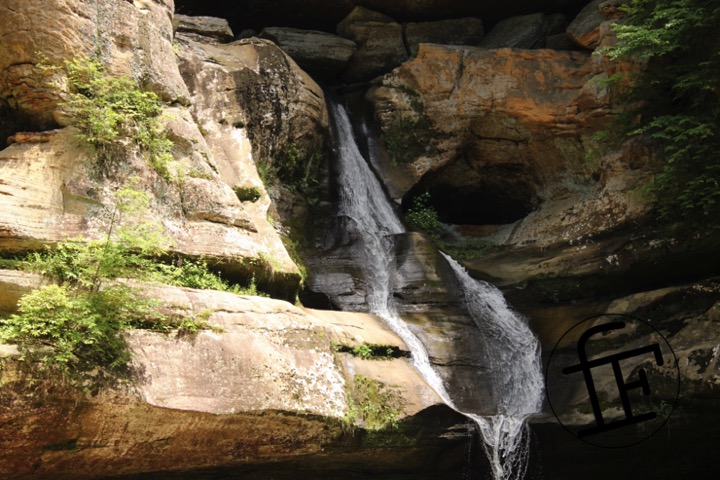 a waterfall flowing down a rock face.