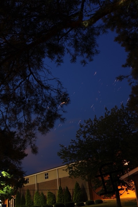 the night sky with leftover firework sparks.