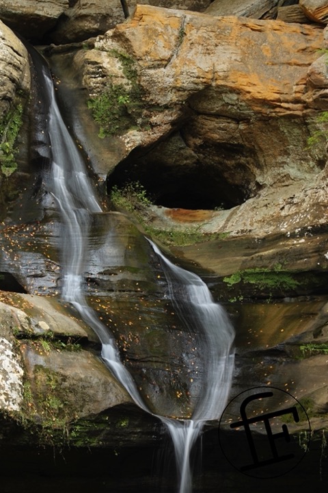 a waterfall flowing down a rock face.